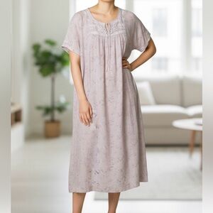 Magnolia Pearl dress - dark cream color w pale pink flowers and green leaves.